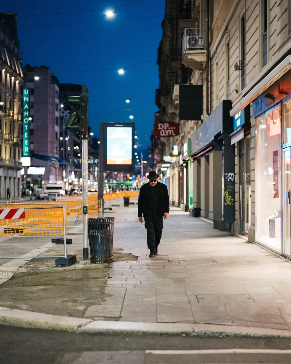 Filippo Giani walking down a street at night